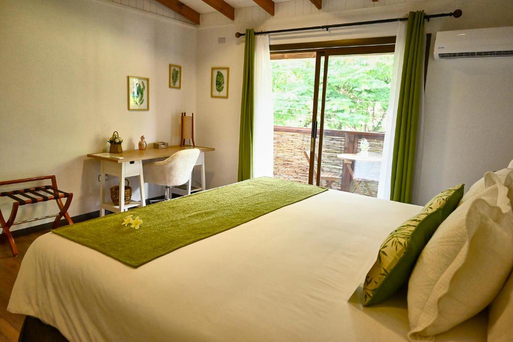 Postel nebo postele na pokoji v ubytování Hare Nua Hotel Boutique