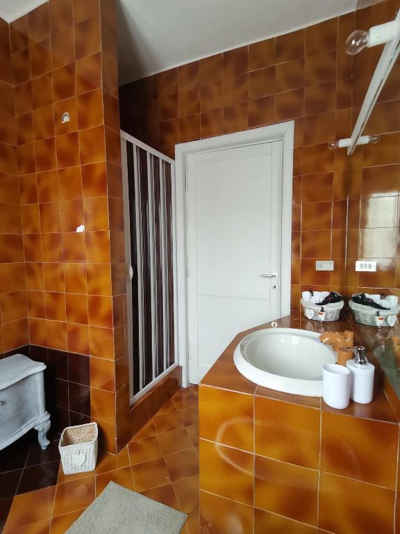 a bathroom with a large tub in a room at Casa Le Cicale in Porto Istana