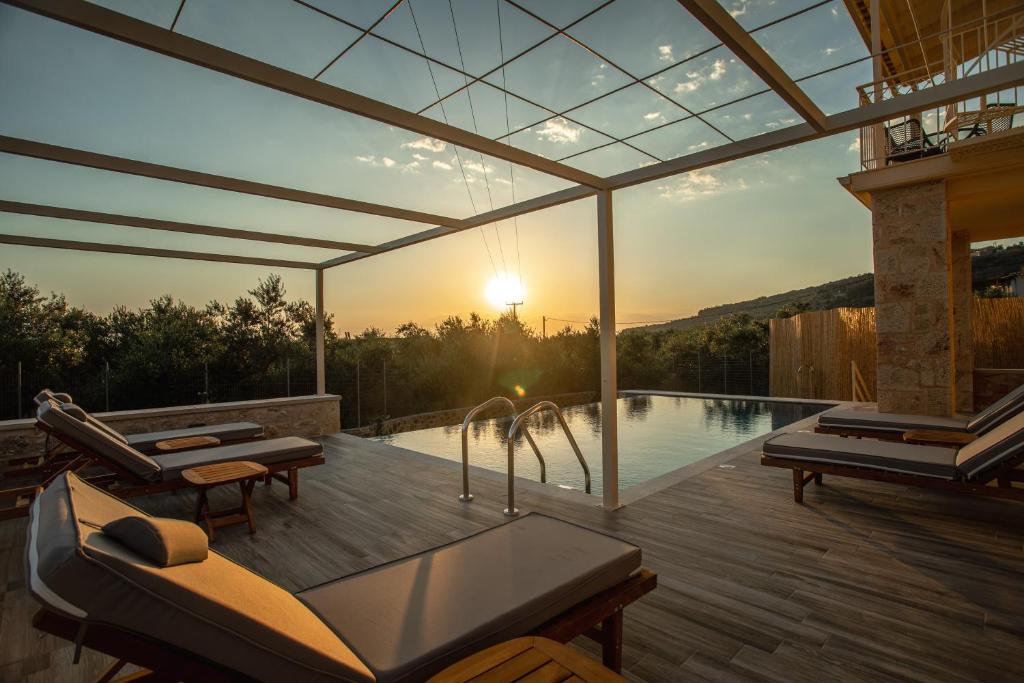 a house with a pool and a deck with a view at Nora's Villa in Riglia