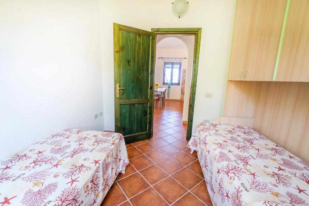 A bed or beds in a room at DOMUS MAIORI LT - PMS CaseVacanze