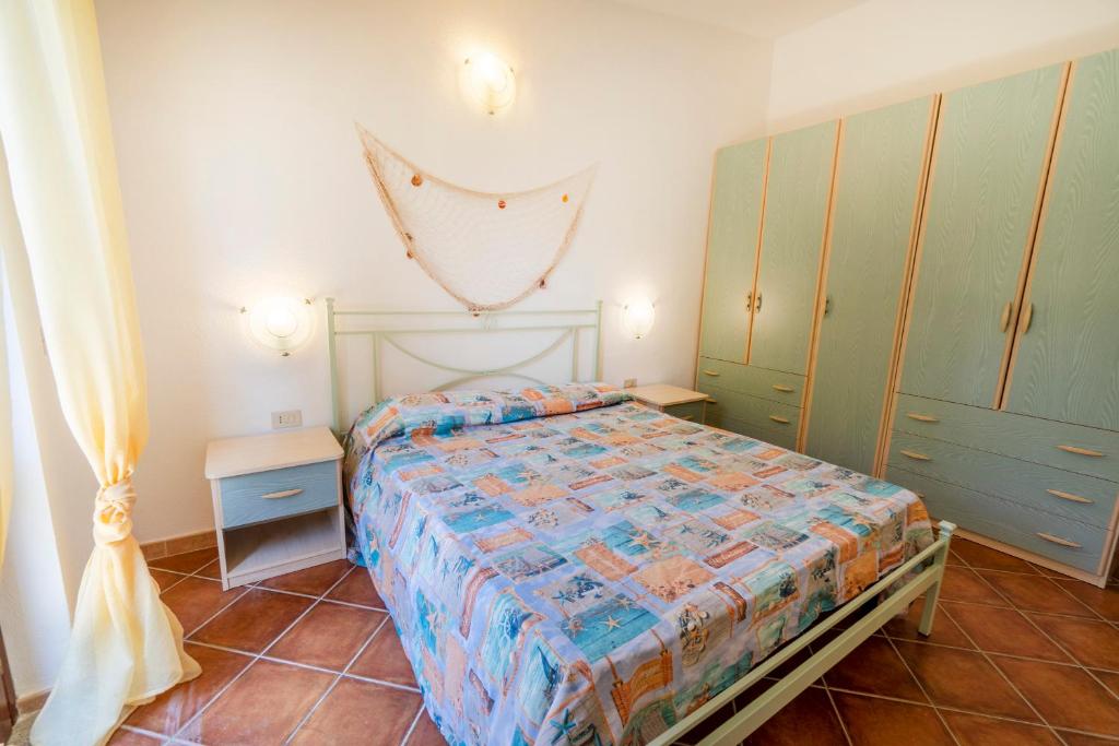 A bed or beds in a room at DOMUS MAIORI LT - PMS CaseVacanze