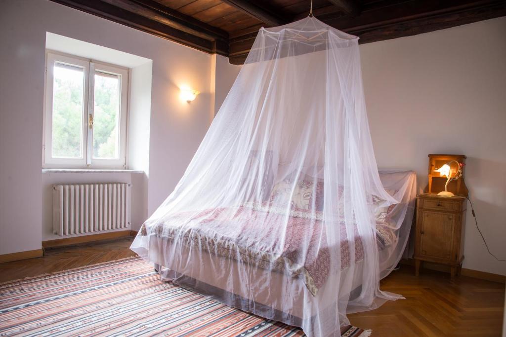 A bed or beds in a room at Heritage mountain top Villa near Rome w/ Pool & Panoramic views
