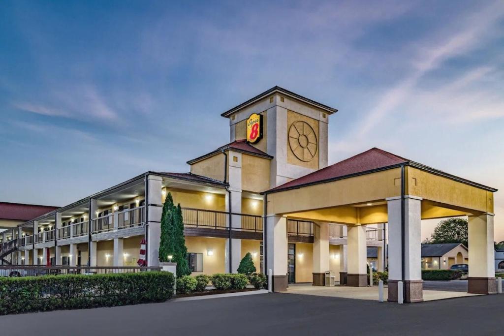 a large building with a clock tower on top of it at Super 8 by Wyndham Columbia in Columbia