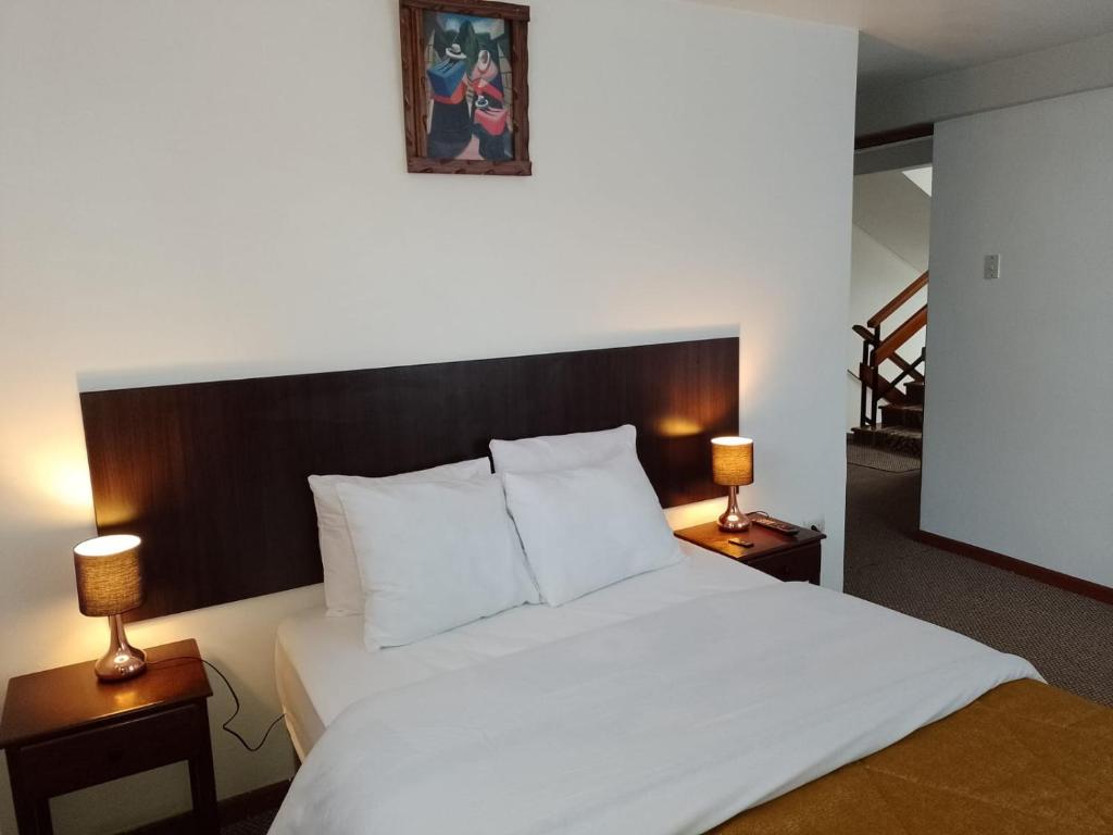 Postel nebo postele na pokoji v ubytování Pukara House