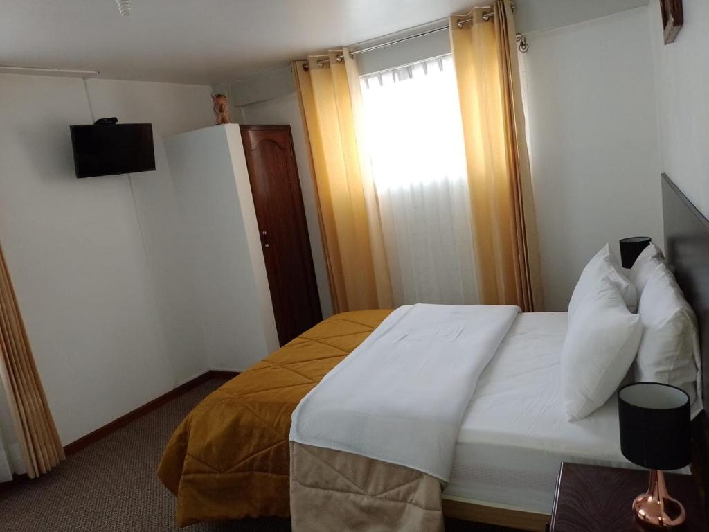 Postel nebo postele na pokoji v ubytování Pukara House