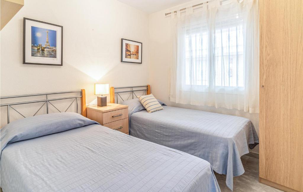 Posteľ alebo postele v izbe v ubytovaní Beautiful Apartment In Benalmádena