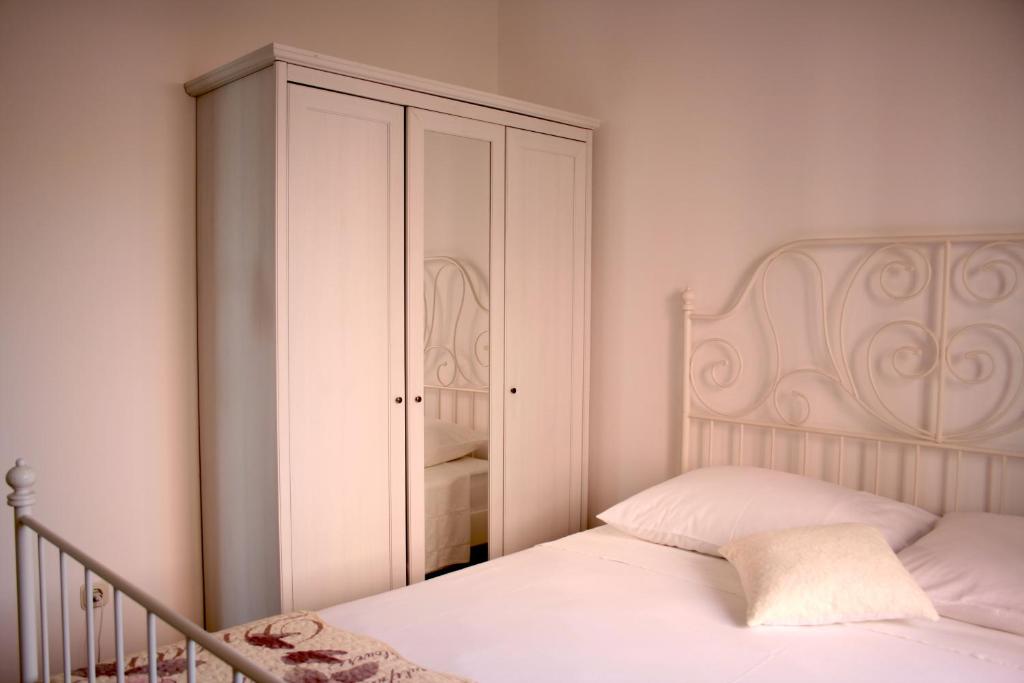 Postel nebo postele na pokoji v ubytování Apartman Laura