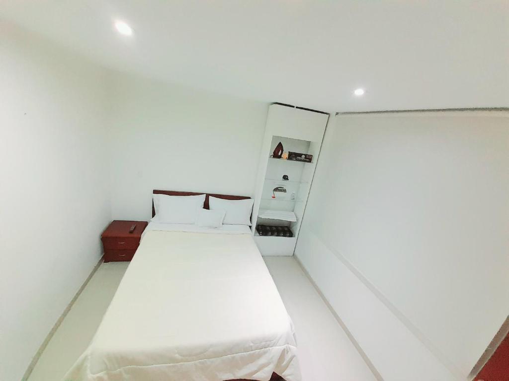 Postel nebo postele na pokoji v ubytování Stay In Bogota