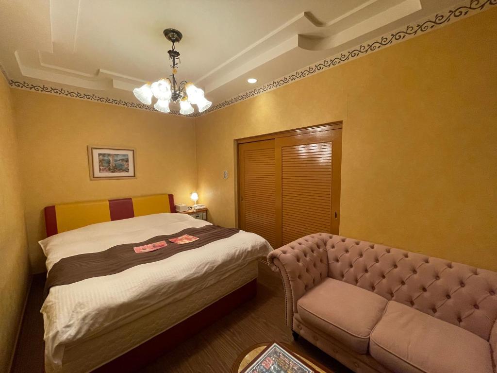 Postel nebo postele na pokoji v ubytování HOTEL マナティ
