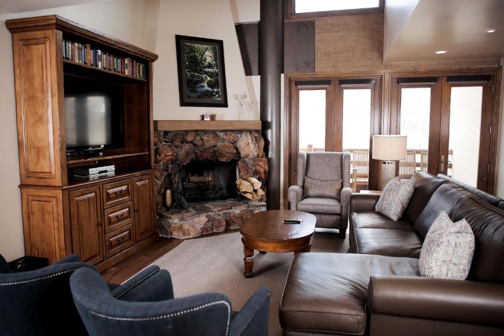 a living room with a couch and a fireplace at Deer Valley Two Bedroom Loft Suite with Easy Access to all Park City has to Offer condo in Park City