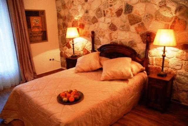 Voodi või voodid majutusasutuse Korina Gallery Hotel toas