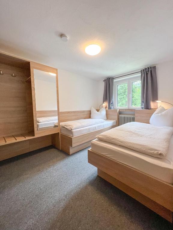 Postel nebo postele na pokoji v ubytování Mountain Hostel City