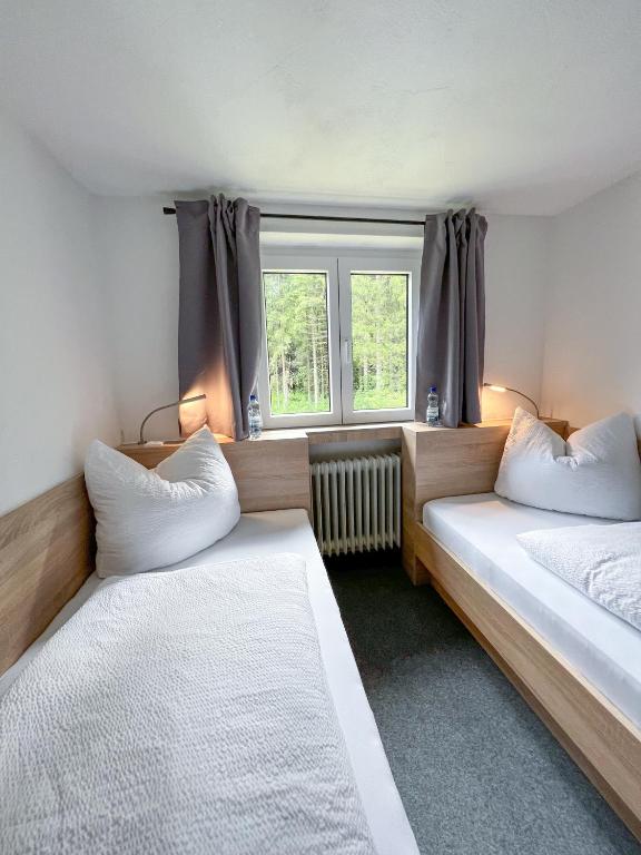 Postel nebo postele na pokoji v ubytování Mountain Hostel City