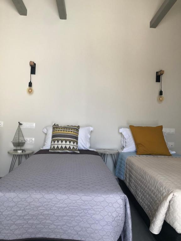 Postel nebo postele na pokoji v ubytování Afrodete Hotel