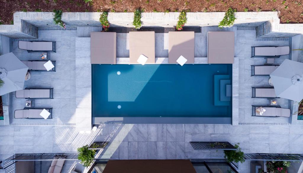 an overhead view of a swimming pool in a building at Le Stanze del Lago Villa Seta in Como
