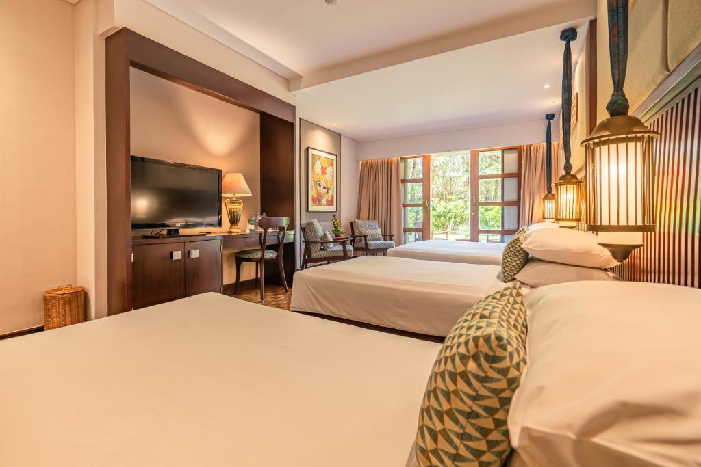 Postel nebo postele na pokoji v ubytování Bintang Bali Resort