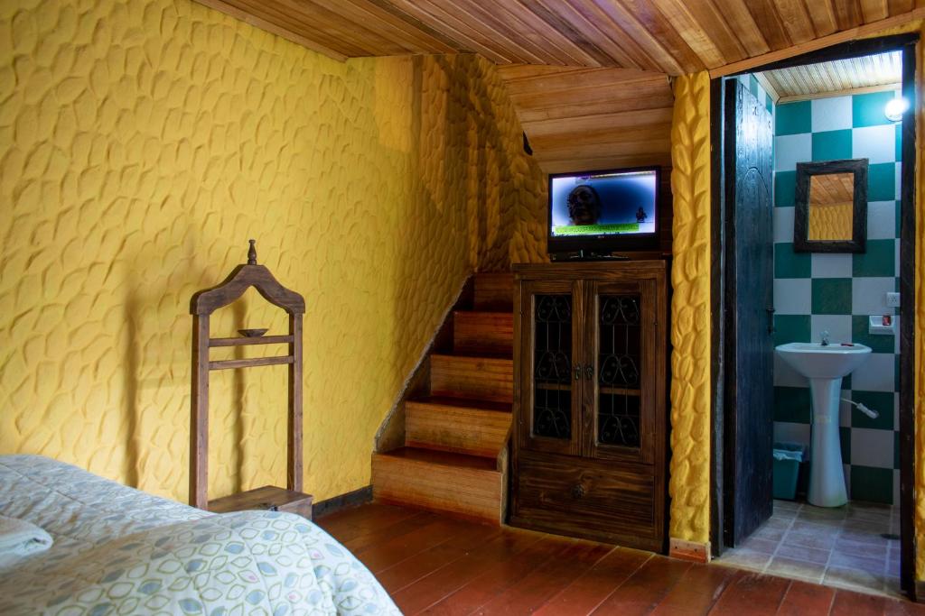 TV a/nebo společenská místnost v ubytování Hotel Museo la Posada del Molino