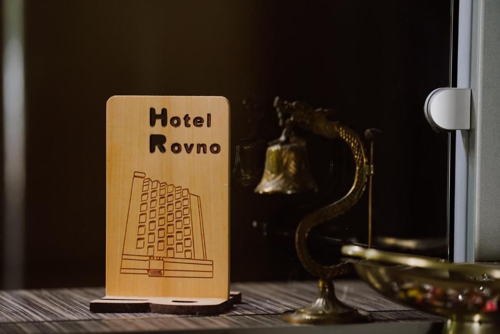 a book sitting on top of a table with a trophy at Rovno Hotel in Vidin