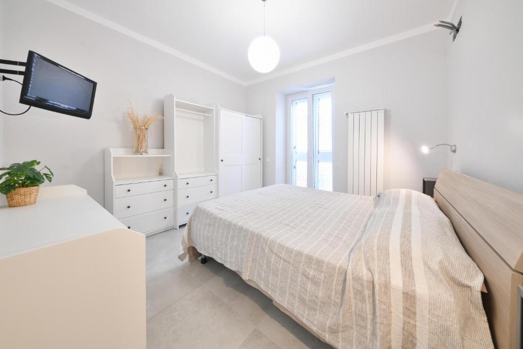 Łóżko lub łóżka w pokoju w obiekcie CASA ARIANNA
