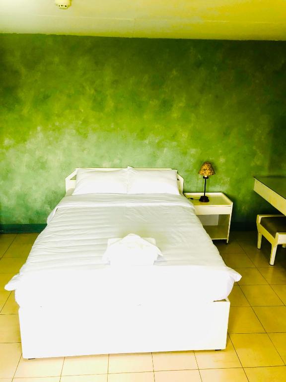 Postel nebo postele na pokoji v ubytování Benson Hotel San Juan CIty