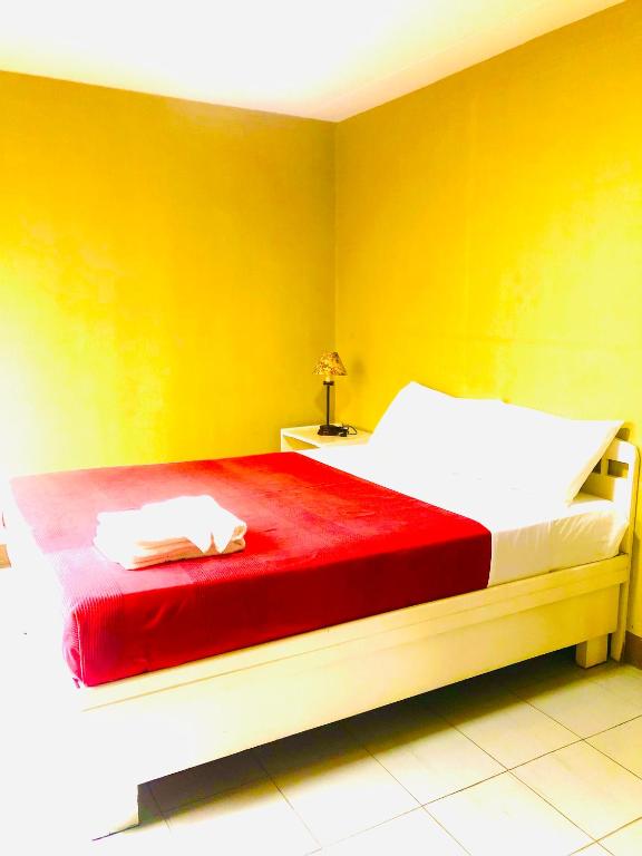 Postel nebo postele na pokoji v ubytování Benson Hotel San Juan CIty