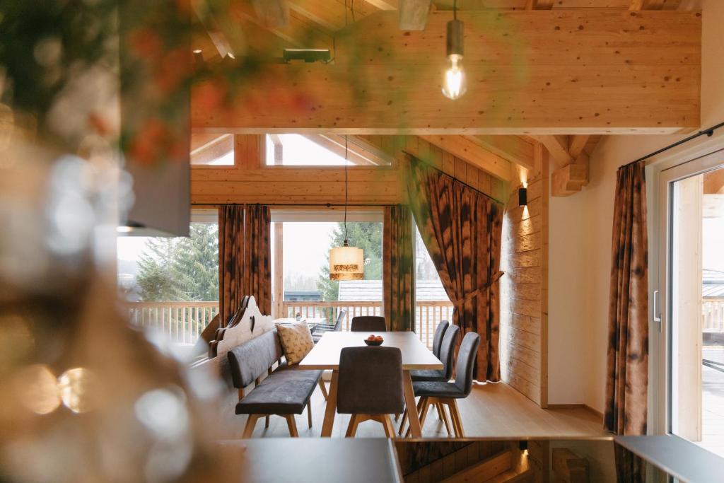 a dining room with a table and chairs at Chalet Village by Apart4you in Ramsau am Dachstein