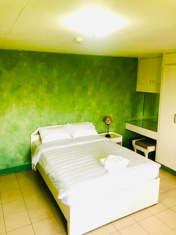 Postel nebo postele na pokoji v ubytování Benson Hotel San Juan CIty