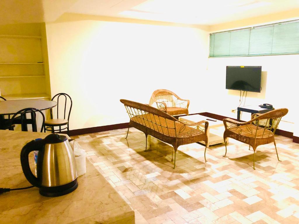 TV a/nebo společenská místnost v ubytování Benson Hotel San Juan CIty