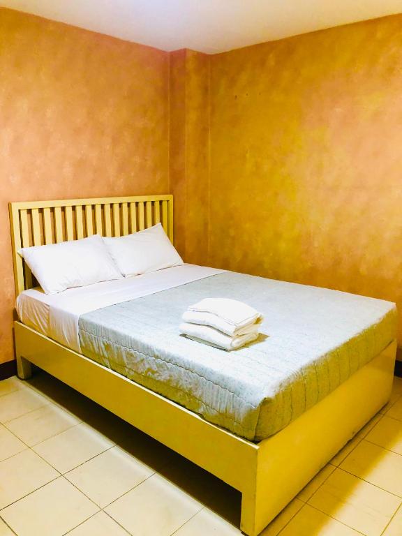Postel nebo postele na pokoji v ubytování Benson Hotel San Juan CIty
