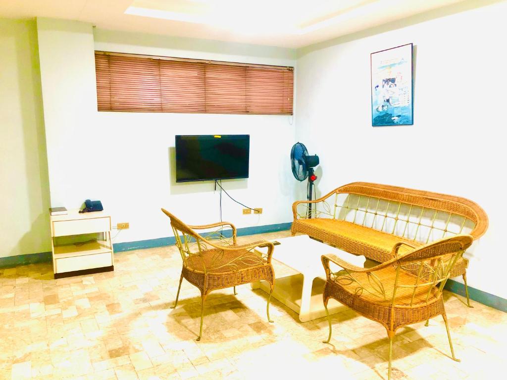 TV a/nebo společenská místnost v ubytování Benson Hotel San Juan CIty