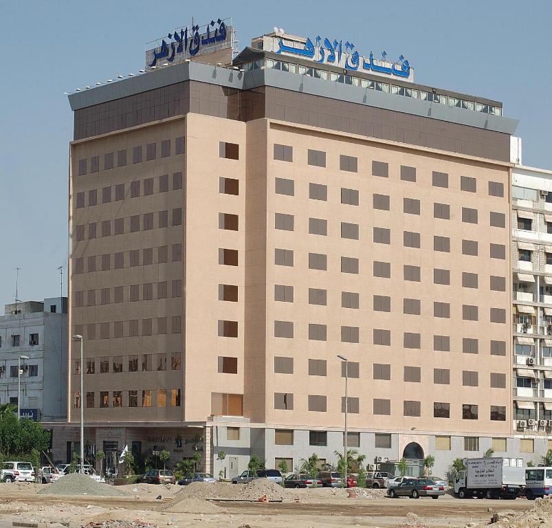 a large building with a sign on top of it at Al Azhar Hotel Jeddah in Jeddah