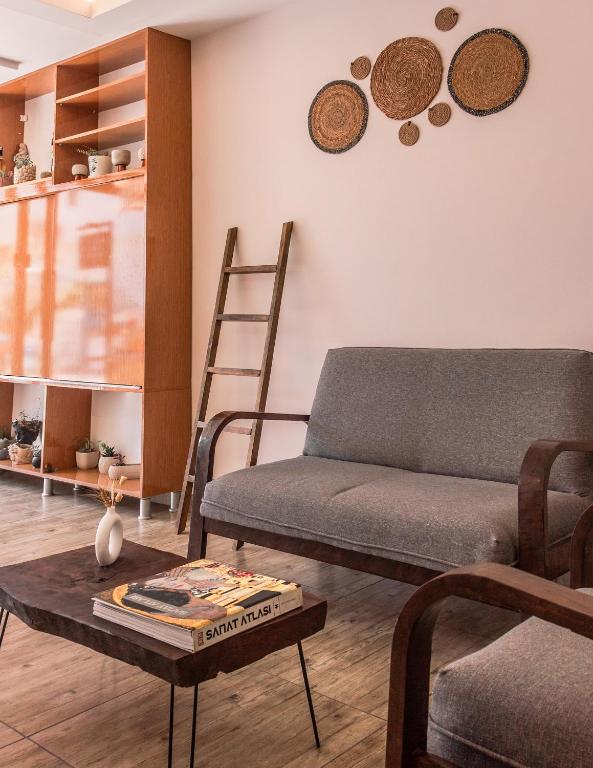 a living room with a couch and a table at Kaş Old Town Hotel in Kaş