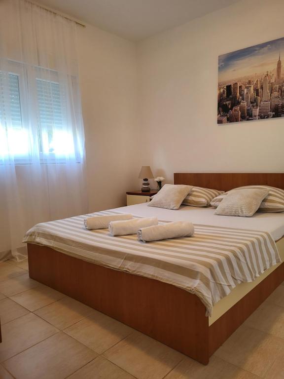 Posteľ alebo postele v izbe v ubytovaní Apartments Bralic