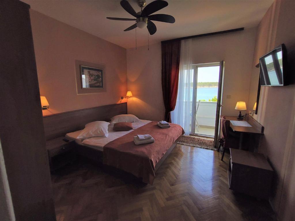 Posteľ alebo postele v izbe v ubytovaní Guest House Palme