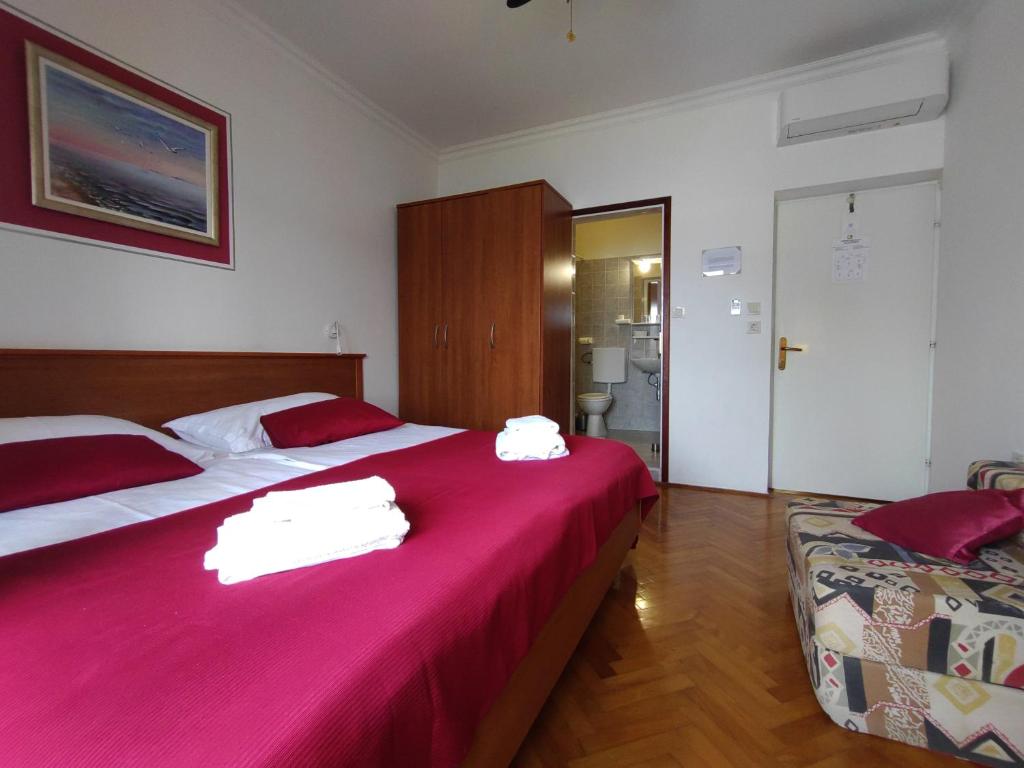 Posteľ alebo postele v izbe v ubytovaní Guest House Palme