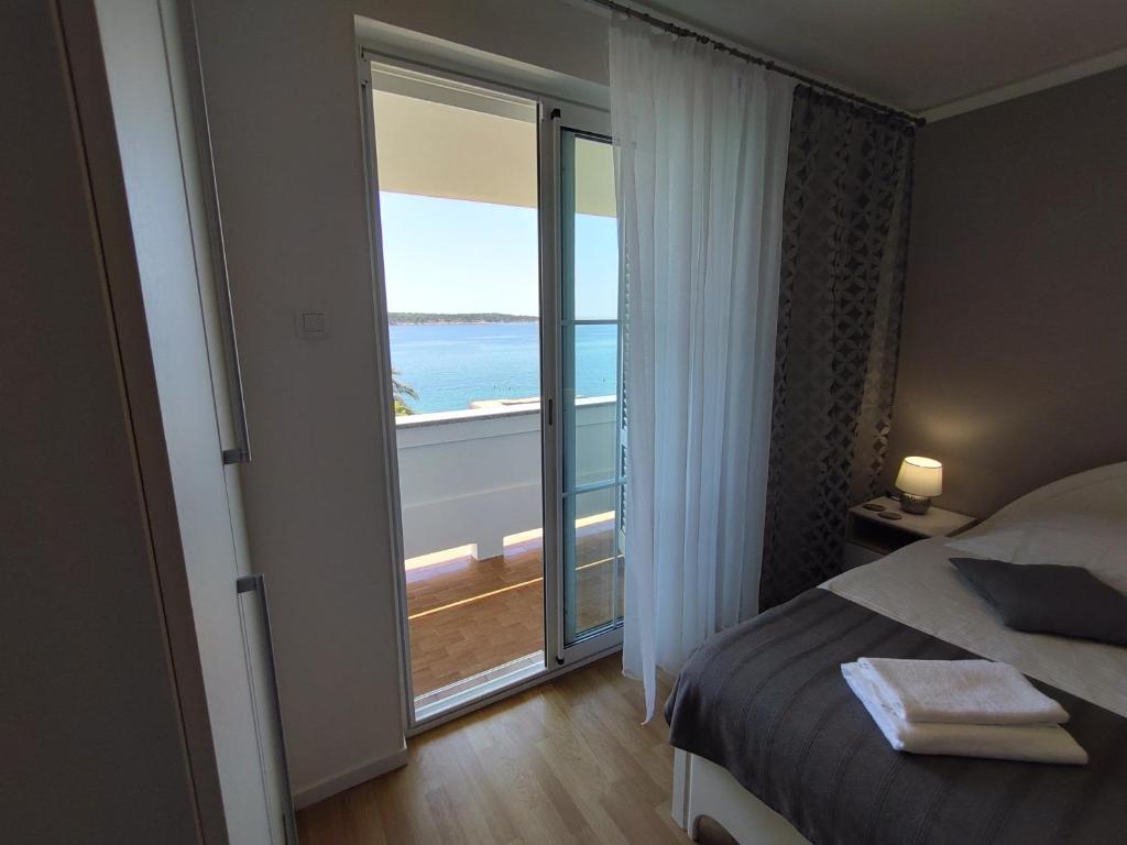 Posteľ alebo postele v izbe v ubytovaní Guest House Palme