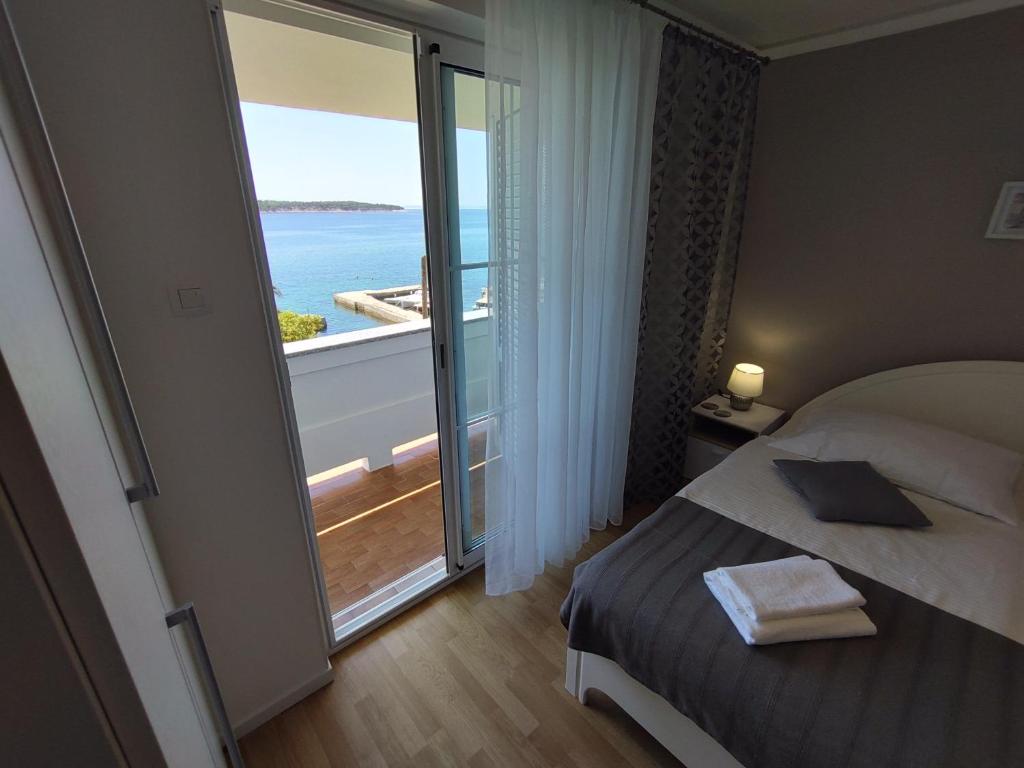 Posteľ alebo postele v izbe v ubytovaní Guest House Palme