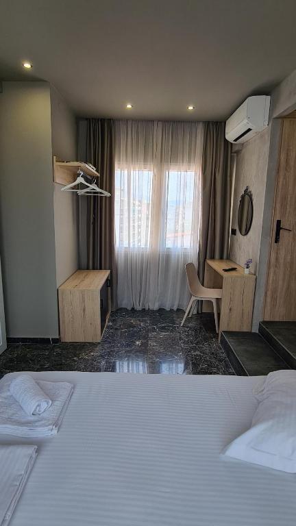 Łóżko lub łóżka w pokoju w obiekcie Ladadika 5th Floor