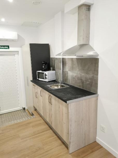 Kuchyň nebo kuchyňský kout v ubytování Villas Camargo.suites