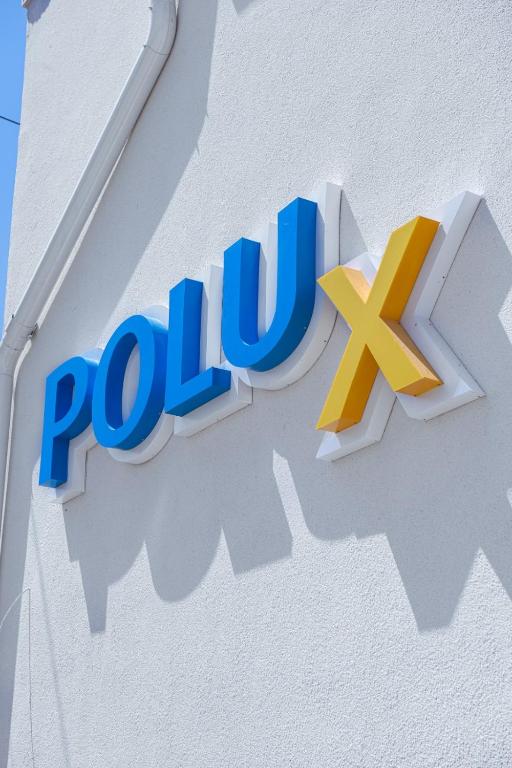 a sign for the polish gas company polut on a building at Polu-X in Vama Veche