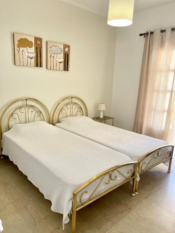 Posteľ alebo postele v izbe v ubytovaní Kommeno Bay Apartments