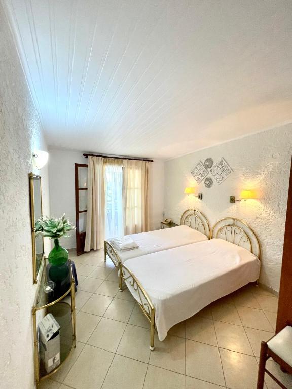 Posteľ alebo postele v izbe v ubytovaní Kommeno Bay Apartments