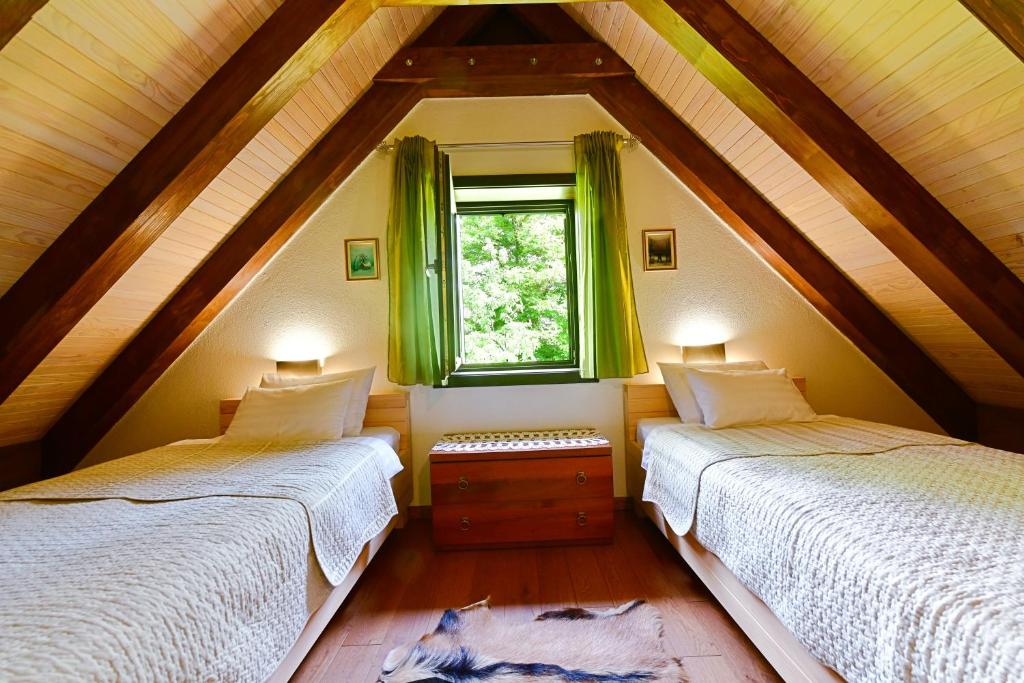 Postel nebo postele na pokoji v ubytování Villa Dobra