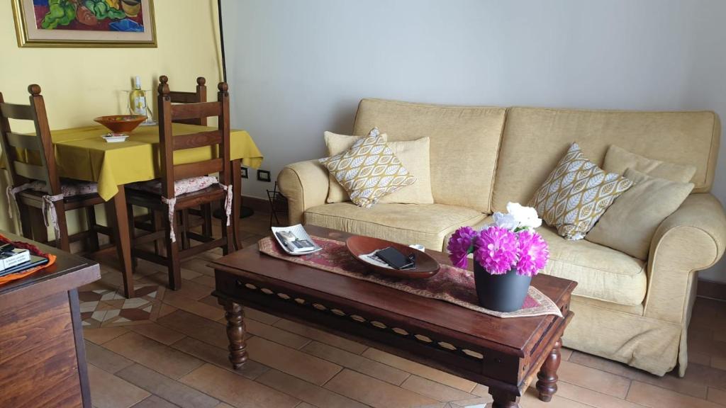 a living room with a couch and a coffee table at Home Casa Professa 2 in Palermo