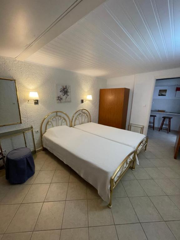 Posteľ alebo postele v izbe v ubytovaní Kommeno Bay Apartments