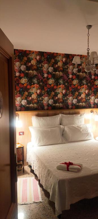 Postel nebo postele na pokoji v ubytování B&B L'Albero Di Antonia