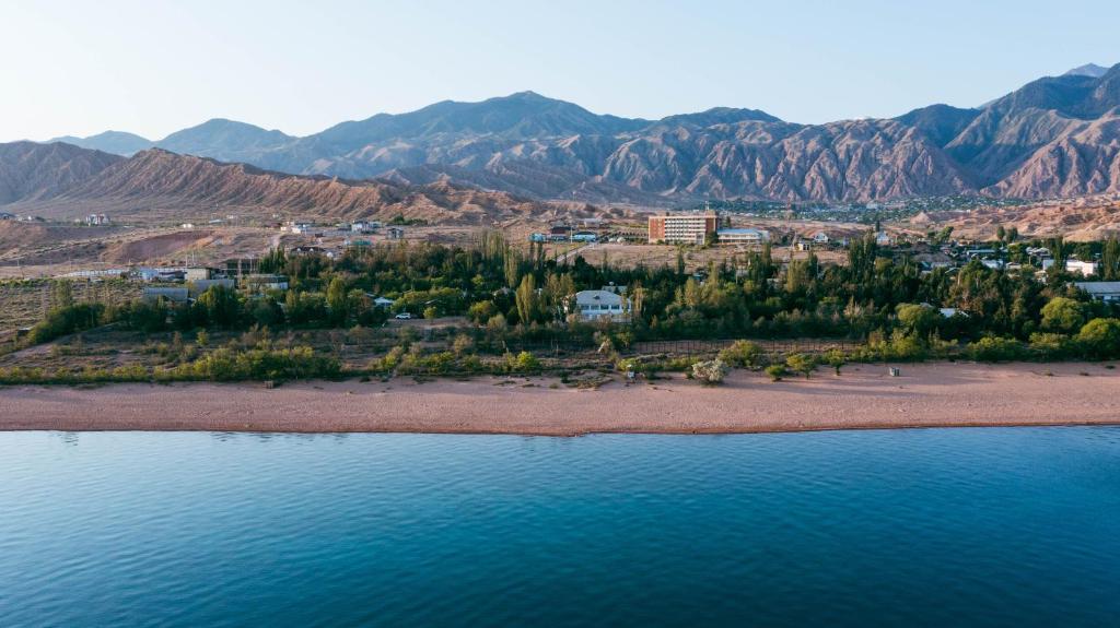 an aerial view of a beach with mountains in the background at Legenda Health Resort in Kaji-Say