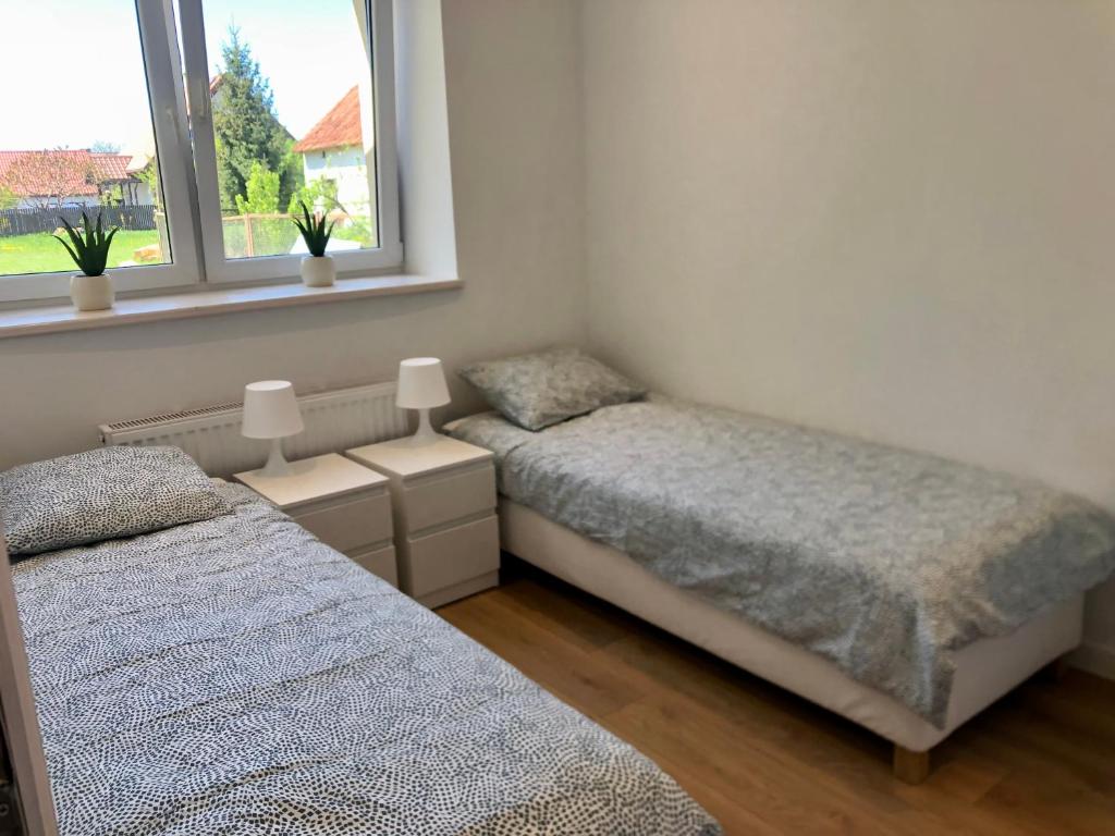 Posteľ alebo postele v izbe v ubytovaní Mazurski Dom