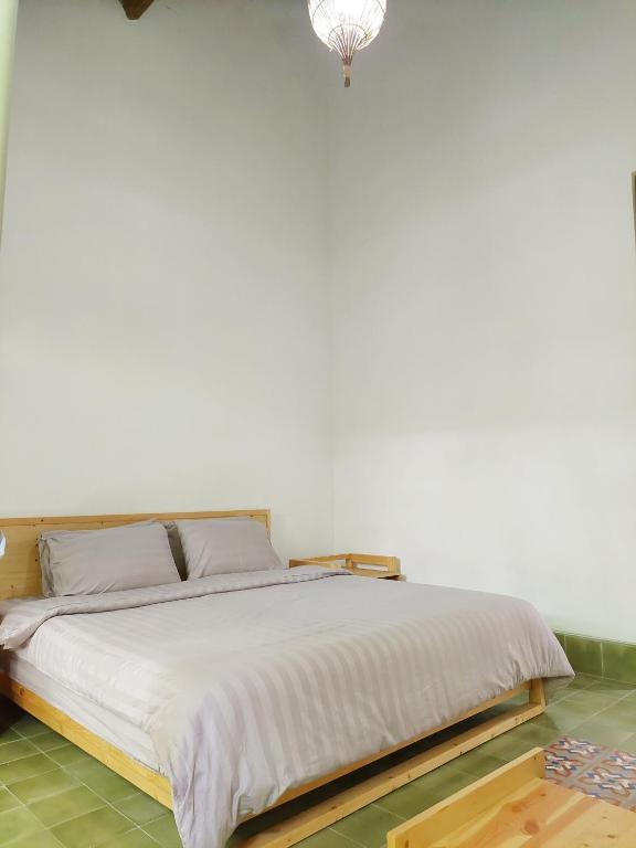 Postel nebo postele na pokoji v ubytování Komoreya Guesthouse