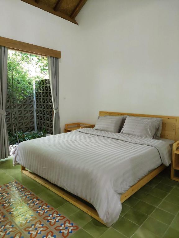 Postel nebo postele na pokoji v ubytování Komoreya Guesthouse